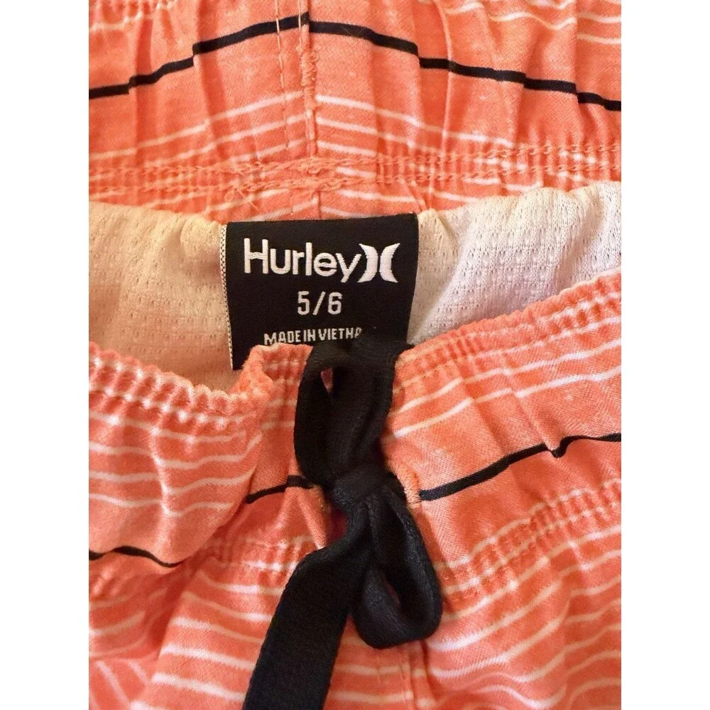 Hurley boys orange stripe swim trunks, size 5/6, with black accents